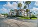 Well maintained building with palm trees, landscaping and ample parking at 1235 S Highland Ave # 2-207, Clearwater, FL 33756