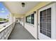 Exterior hallway with unit entry doors, view of parking area and decorative railing at 1235 S Highland Ave # 2-207, Clearwater, FL 33756
