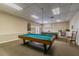 Bright game room features two billiard tables, comfortable seating, and a classic decor for community enjoyment at 1235 S Highland Ave # 2-207, Clearwater, FL 33756