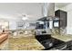 Modern kitchen featuring granite countertops and stainless steel appliances at 1235 S Highland Ave # 2-207, Clearwater, FL 33756