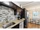Stylish kitchen featuring stainless steel appliances and granite countertops at 1235 S Highland Ave # 2-207, Clearwater, FL 33756
