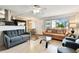 Bright living room featuring contemporary decor, modern lighting and an open view to the kitchen at 1235 S Highland Ave # 2-207, Clearwater, FL 33756
