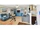 Bright living room with hardwood floors that opens to the kitchen and lots of natural light at 1235 S Highland Ave # 2-207, Clearwater, FL 33756