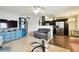 Open living room with view of the kitchen, hardwood floors, ceiling fan and lots of natural light at 1235 S Highland Ave # 2-207, Clearwater, FL 33756