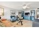 Living room with plenty of seating, hardwood floors, ceiling fan and natural light at 1235 S Highland Ave # 2-207, Clearwater, FL 33756