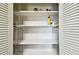 Pantry includes multiple shelves with visible stored items at 1235 S Highland Ave # 2-207, Clearwater, FL 33756