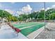 Outdoor shuffleboard court features benches and beautiful landscaping and pool in a community at 1235 S Highland Ave # 2-207, Clearwater, FL 33756