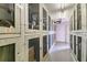 Community storage with multiple wire-enclosed units for residents' convenience and organization near white painted doors at 1235 S Highland Ave # 2-207, Clearwater, FL 33756