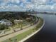 An aerial view features luxury waterfront homes along Bayshore Boulevard in Tampa, Florida, with skyline views at 12419 Dawn Vista Dr, Riverview, FL 33578