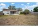 View of the backyard with a screened-in porch at 12419 Dawn Vista Dr, Riverview, FL 33578