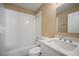 Bathroom with white subway tile in shower/tub, vanity, and wood-look floors at 12419 Dawn Vista Dr, Riverview, FL 33578