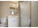 Bright bathroom features a modern vanity, updated fixtures, and walk-in shower with seamless glass door at 12419 Dawn Vista Dr, Riverview, FL 33578