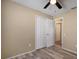 Bedroom with wood-look floors and closet at 12419 Dawn Vista Dr, Riverview, FL 33578