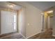 Inviting entryway with wood-look flooring, fresh paint, and a view to additional rooms in the home at 12419 Dawn Vista Dr, Riverview, FL 33578