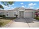 Single-story home features well-manicured lawn and attached one-car garage with ample driveway space at 12419 Dawn Vista Dr, Riverview, FL 33578