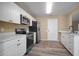 Kitchen featuring stainless steel appliances and white cabinetry at 12419 Dawn Vista Dr, Riverview, FL 33578
