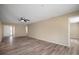 Spacious living room featuring wood-look flooring and a view into other rooms at 12419 Dawn Vista Dr, Riverview, FL 33578