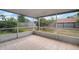 Screened porch with tiled floor overlooking the fenced-in backyard at 12419 Dawn Vista Dr, Riverview, FL 33578
