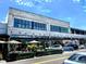 Exterior view of retail shops, including Bonobos, Madewell and Sunni Spencer, with outdoor seating at 12419 Dawn Vista Dr, Riverview, FL 33578