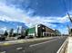 Street view of an office complex with parking and landscaping under a blue and cloudy sky at 12419 Dawn Vista Dr, Riverview, FL 33578