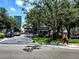 Street view showcasing Dakota Avenue's commercial area, trees, and pedestrian activity on a sunny day at 12419 Dawn Vista Dr, Riverview, FL 33578