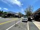 Street view of retail establishments, greenery, outdoor dining under a blue sky at 12419 Dawn Vista Dr, Riverview, FL 33578