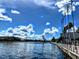 Picturesque waterfront featuring a bridge, clear blue skies, and modern architecture, creating a serene and attractive environment at 12419 Dawn Vista Dr, Riverview, FL 33578