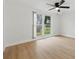 Spacious bedroom with a large window providing ample natural light at 12601 Stone House Loop, Hudson, FL 34667