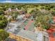 Aerial view showcasing the community amenities including pool, tennis courts, bocce ball, and basketball courts at 12601 Stone House Loop, Hudson, FL 34667