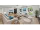 Bright, modern living room with stylish furniture, area rug, and natural light, creating a welcoming space at 12601 Stone House Loop, Hudson, FL 34667