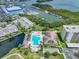 Aerial view of the neighborhood pool, hot tub, clubhouse, and the marina at 1332 Pasadena S Ave # 503, South Pasadena, FL 33707