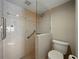 Updated bathroom with tiled walk-in shower featuring safety bars and a seat at 1332 Pasadena S Ave # 503, South Pasadena, FL 33707