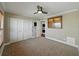 Bedroom featuring carpet, closet, and a stackable washer/dryer at 1332 Pasadena S Ave # 503, South Pasadena, FL 33707