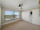 Bright bedroom with carpet, a window, and closet space at 1332 Pasadena S Ave # 503, South Pasadena, FL 33707