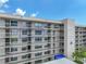 Close up of condo balcony, showing railing and windows, along with the building architecture at 1332 Pasadena S Ave # 503, South Pasadena, FL 33707
