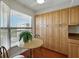 Eat-in kitchen featuring built in cabinets, a window and a small table and chairs at 1332 Pasadena S Ave # 503, South Pasadena, FL 33707