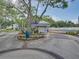 Neighborhood entrance featuring mature landscaping and a covered guard house at 1332 Pasadena S Ave # 503, South Pasadena, FL 33707