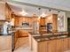 Spacious kitchen featuring stainless steel appliances, granite countertops, and plenty of wood cabinetry at 1332 Pasadena S Ave # 503, South Pasadena, FL 33707