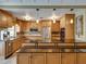 Open concept kitchen with stylish pendant lighting, stainless appliances, and ample cabinet space at 1332 Pasadena S Ave # 503, South Pasadena, FL 33707