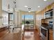 Kitchen area with wood floors, granite counters, stainless appliances and an eat-in area at 1332 Pasadena S Ave # 503, South Pasadena, FL 33707