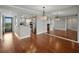 Open-concept living area with hardwood flooring, adjacent to the kitchen and balcony at 1332 Pasadena S Ave # 503, South Pasadena, FL 33707