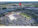 An aerial shot of the community recreation center with pool, sports fields, and parking at 1349 New Bedford Dr # 6, Sun City Center, FL 33573