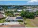 Aerial view of home featuring well-maintained lawn and solar panels near shopping and roadways at 1349 New Bedford Dr # 6, Sun City Center, FL 33573