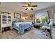 Bedroom with a bed, window, and desk for relaxing and working at 1349 New Bedford Dr # 6, Sun City Center, FL 33573