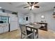 Dining area featuring tile floors, a table with seating, and lots of natural light at 1349 New Bedford Dr # 6, Sun City Center, FL 33573