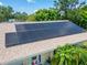 Aerial view of solar panels on the roof of the home, offering energy efficiency and sustainability at 1349 New Bedford Dr # 6, Sun City Center, FL 33573