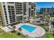 Complex with multiple towers, pool area, parking, landscaping and beach access at 1480 Gulf Blvd # 109, Clearwater Beach, FL 33767