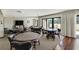 Spacious common room with ample seating, tables, television and views at 1480 Gulf Blvd # 109, Clearwater Beach, FL 33767