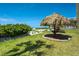 Landscaped grounds feature covered picnic area with tables and views of the beach at 1480 Gulf Blvd # 109, Clearwater Beach, FL 33767