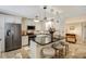 Spacious kitchen with stainless steel appliances, granite countertops, and bar stool seating at 1480 Gulf Blvd # 109, Clearwater Beach, FL 33767